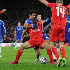 Costa doing something to Liverpool Captain Gerrard in their League Cup Clash